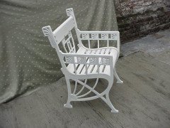 A pair of successionist cast iron garden seats with a matching four seater bench. - Thumbnail 9