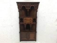 Liberty and Co. A walnut corner cupboard in the Moorish style. - Thumbnail 1