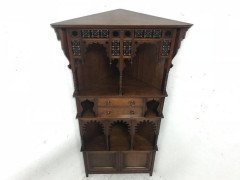 Liberty and Co. A walnut corner cupboard in the Moorish style. - Thumbnail 2