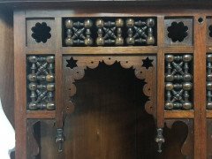 Liberty and Co. A walnut corner cupboard in the Moorish style. - Thumbnail 4