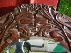 A large Arts and Crafts oak mirror with floral carving of superior craftsmanship. - Thumbnail 4