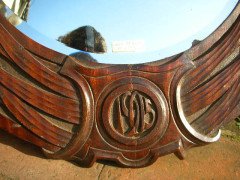 A large Arts and Crafts oak mirror with floral carving of superior craftsmanship. - Thumbnail 6
