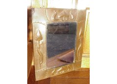 Liberty and Co (attributed). A copper mirror with hand formed stylised floral details. - Thumbnail 1