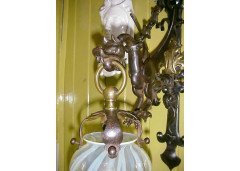 A hand wrought iron dragon wall light with original Vaseline flame shade. - Thumbnail 2