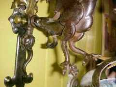 A hand wrought iron dragon wall light with original Vaseline flame shade. - Thumbnail 6