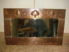 Liberty and Co. A copper mirror with hand formed stylised tree designs after a design by C F A Voysey - Thumbnail 1