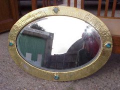 Liberty and Co. A rare Arts and Crafts brass oval mirror - Thumbnail 1