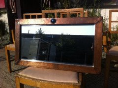Liberty and Co. An Arts and Crafts copper mirror with blue enamel roundel - Thumbnail 1