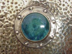 Liberty and Co. A large Arts and Crafts brass mirror with Ruskin roundels. - Thumbnail 2