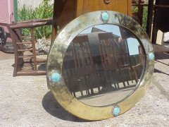 Liberty and Co. A brass mirror with four Ruskin ceramic discs rivetted into place. - Thumbnail 1