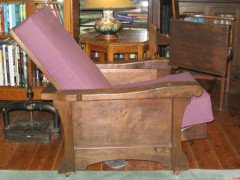 An Arts and Crafts oak reading reclining armchair - Thumbnail 1