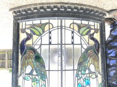 A stunning bow fronted stained glass Peacock panel in its original window frame - Thumbnail 8