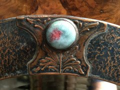 Liberty and Co (style of). An Arts and Crafts circular copper mirror inset with four turquoise and red Ruskin jewels. - Thumbnail 2