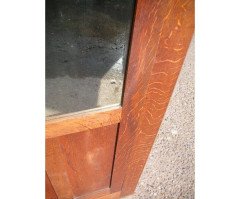 A quality tall Arts and Crafts oak cupboard with central bevelled mirror - Thumbnail 4