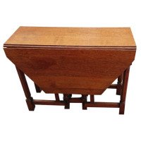 Heals, attributed. An English Arts & Crafts Oak Drop Leaf Hexagonal Dining Table