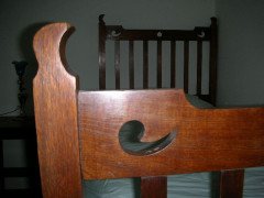 Liberty & Co., attributed. An Arts & Crafts Oak Bed with Stylized Floral Cut-Outs - Thumbnail 3