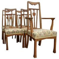 Liberty & Co., A Set of Five Arts & Crafts Oak Dining Chairs with Heart Details - Thumbnail 1