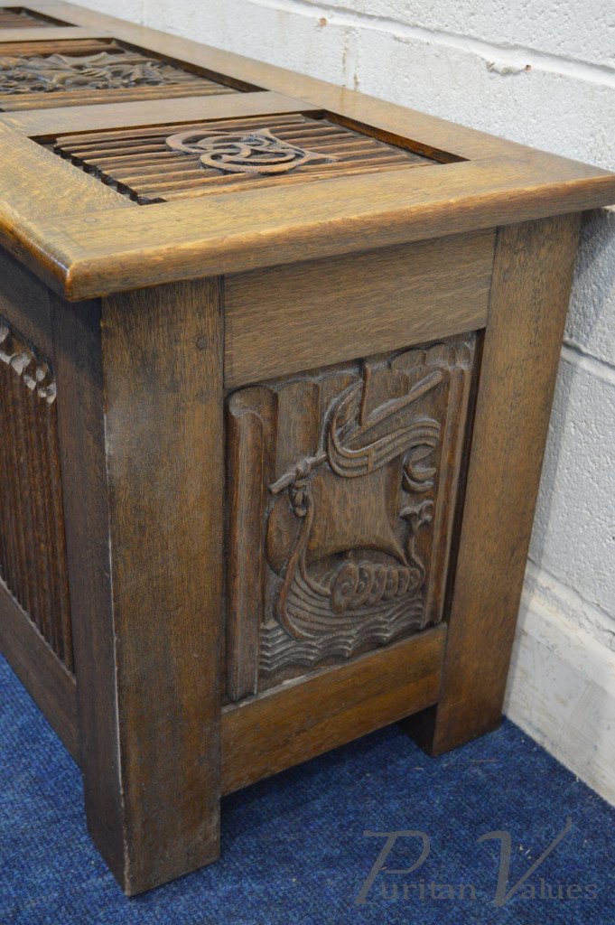 Oak_Blanket_Chest_with_linenfold_panels_to_all_sides_carved_dragons_to_the_top_and_front_date_reading_1938_two_initials_to_the_lid_W112cm_D46cm_H56cm3_master