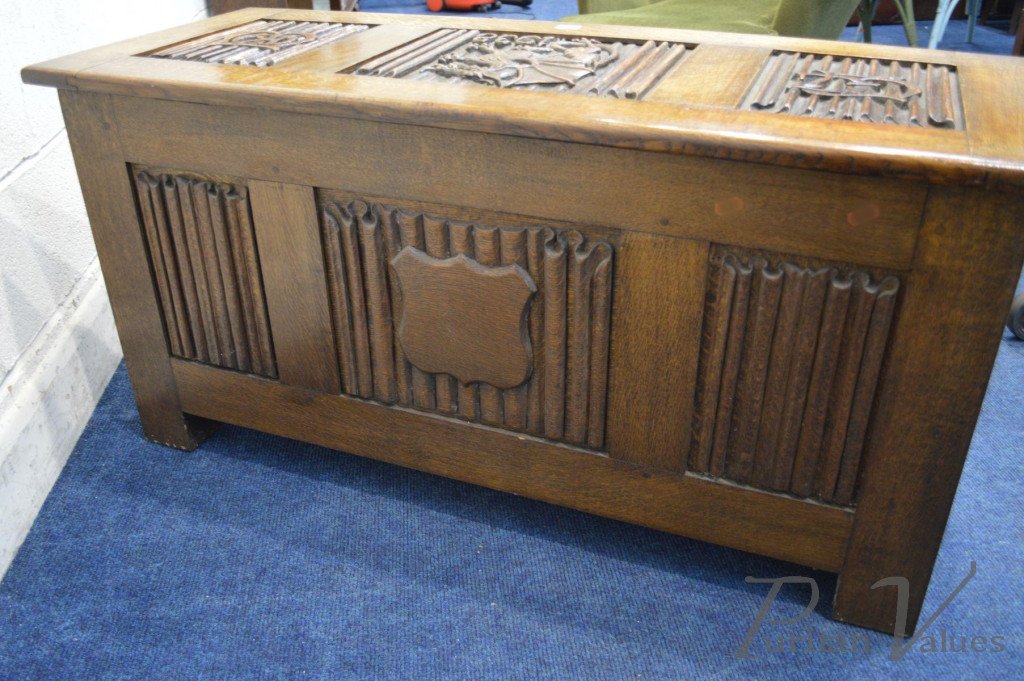 Oak_Blanket_Chest_with_linenfold_panels_to_all_sides_carved_dragons_to_the_top_and_front_date_reading_1938_two_initials_to_the_lid_W112cm_D46cm_H56cm6_master