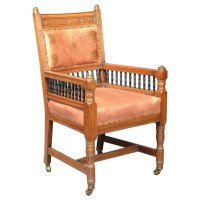 E W Godwin. An Aesthetic Movement Carved Oak Armchair with Ebonized Spindles - Thumbnail 1