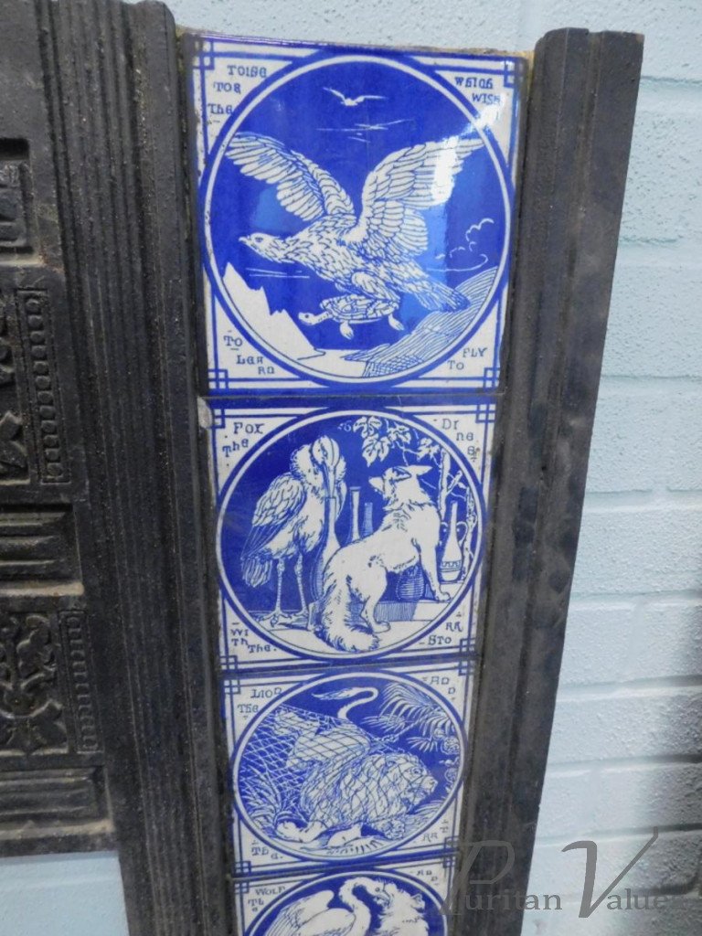 Aesthetic_cast_iron_fire_inserts_each_with_twelve_Minton_tiles_printed_in_blue_with_a_design_of_Aesops_Fables_by_Moyr_Smith_H97cm_W97_5cm_master