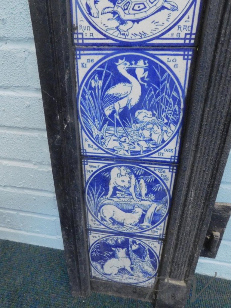 Aesthetic_cast_iron_fire_inserts_each_with_twelve_Minton_tiles_printed_in_blue_with_a_design_of_Aesops_Fables_after_Moyr_Smith_H97cm_W97_5cm_master
