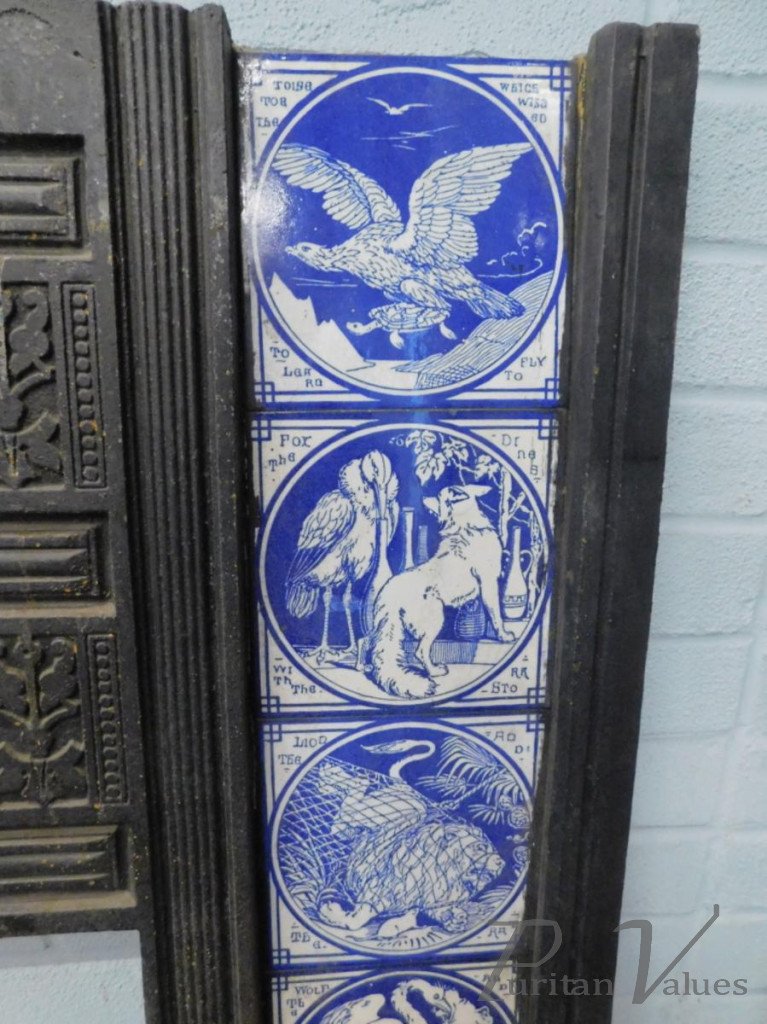Aesthetic_cast_iron_fire_inserts_each_with_twelve_Minton_tiles_printed_in_blue_with_a_design_of_Aesops_Fables_by_Moyr_Smith_H97cm_W97_5cm5_master