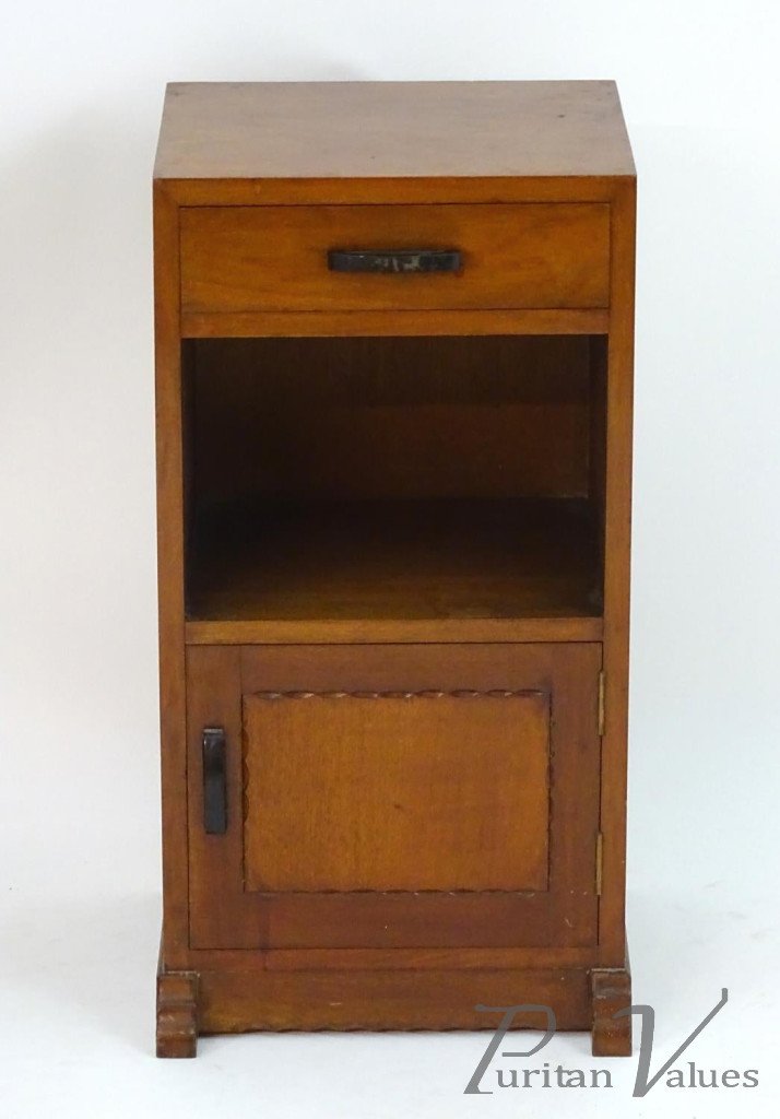 Cotswold_school_bedside_cabinet_with_a_single_short_drawer_with_an_ebonised_handle_above_a_carved_door_on_shaped_feet_with_a_carved_details_14inches_wide_x_12_deep_x_28_high2_master