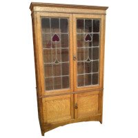 Arts & Crafts Oak Bookcase with Stylized Floral Stain Glass and a Cupboard below - Thumbnail 1
