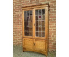 Arts & Crafts Oak Bookcase with Stylized Floral Stain Glass and a Cupboard below - Thumbnail 2