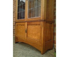 Arts & Crafts Oak Bookcase with Stylized Floral Stain Glass and a Cupboard below - Thumbnail 5