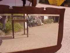 An Arts & Crafts Shaped Oak Bevelled Mirror with Stylised Floral Copper Details - Thumbnail 2