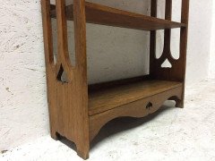 Liberty & Co Attributed, an Arts & Crafts Oak Bookcase with floral cut-outs - Thumbnail 1