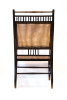 E W Godwin. An Anglo-Japanese Ebonized Beech and Caned Armchair - Thumbnail 1