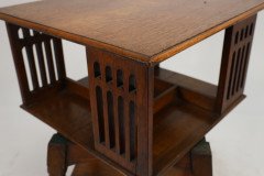 Liberty & Co. An Arts & Crafts Oak Revolving Bookcase Table on Square Turned Legs - Thumbnail 17