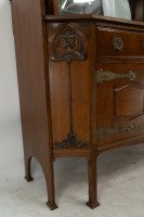 Liberty & Co., attributed. An English Arts & Crafts Oak Sideboard with Carved Decoration - Thumbnail 5