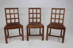 Heals of London, Attr. A set of three Arts and Crafts lattice-back chairs with matching armchair - Thumbnail 2