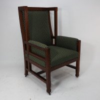 Liberty and Co, attributed, in the style of Leonard Wyburd. An Arts and Crafts oak wing back armchair - Thumbnail 1