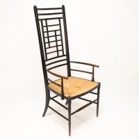 James Plucknett, attributed. Probably for Collier & Plucknett. An Exaggerated High Back Anglo-Japanese Ebonized Armchair