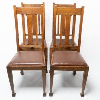 A Set of Four Arts & Crafts Oak Dining Chairs with Comfortable Shaped Backs