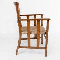 Liberty & Co., An Arts & Crafts Rush Seat Armchair with a Shaped Back - Thumbnail 4
