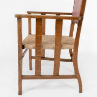 Liberty & Co., An Arts & Crafts Rush Seat Armchair with a Shaped Back - Thumbnail 15