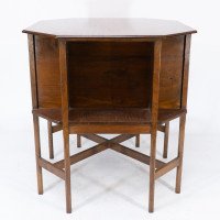 Ambrose Heals attri. An Arts & Crafts oak octagonal book table with eight legs - Thumbnail 2