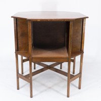 Ambrose Heals attri. An Arts & Crafts oak octagonal book table with eight legs - Thumbnail 4