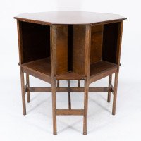 Ambrose Heals attri. An Arts & Crafts oak octagonal book table with eight legs - Thumbnail 3