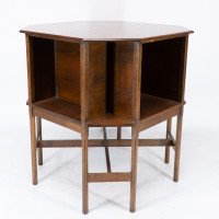 Ambrose Heals attri. An Arts & Crafts oak octagonal book table with eight legs - Thumbnail 5