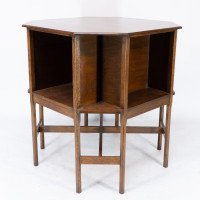 Ambrose Heals attri. An Arts & Crafts oak octagonal book table with eight legs - Thumbnail 7