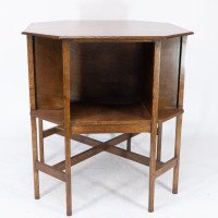 Ambrose Heals attri. An Arts & Crafts oak octagonal book table with eight legs - Thumbnail 8