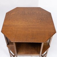 Ambrose Heals attri. An Arts & Crafts oak octagonal book table with eight legs - Thumbnail 10