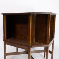 Ambrose Heals attri. An Arts & Crafts oak octagonal book table with eight legs - Thumbnail 12